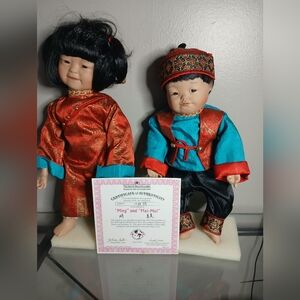 Traditional Asian Doll Set with Red and Blue OutfitsVintage 1994 Ashton Drake